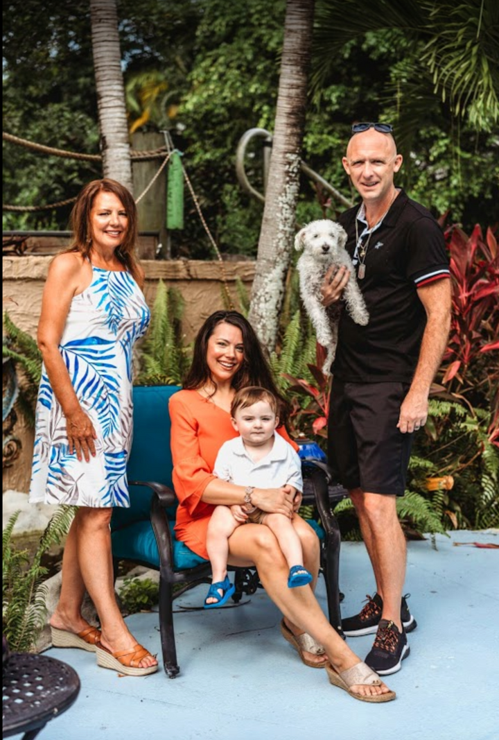 The Claunch family together in a tropical garden